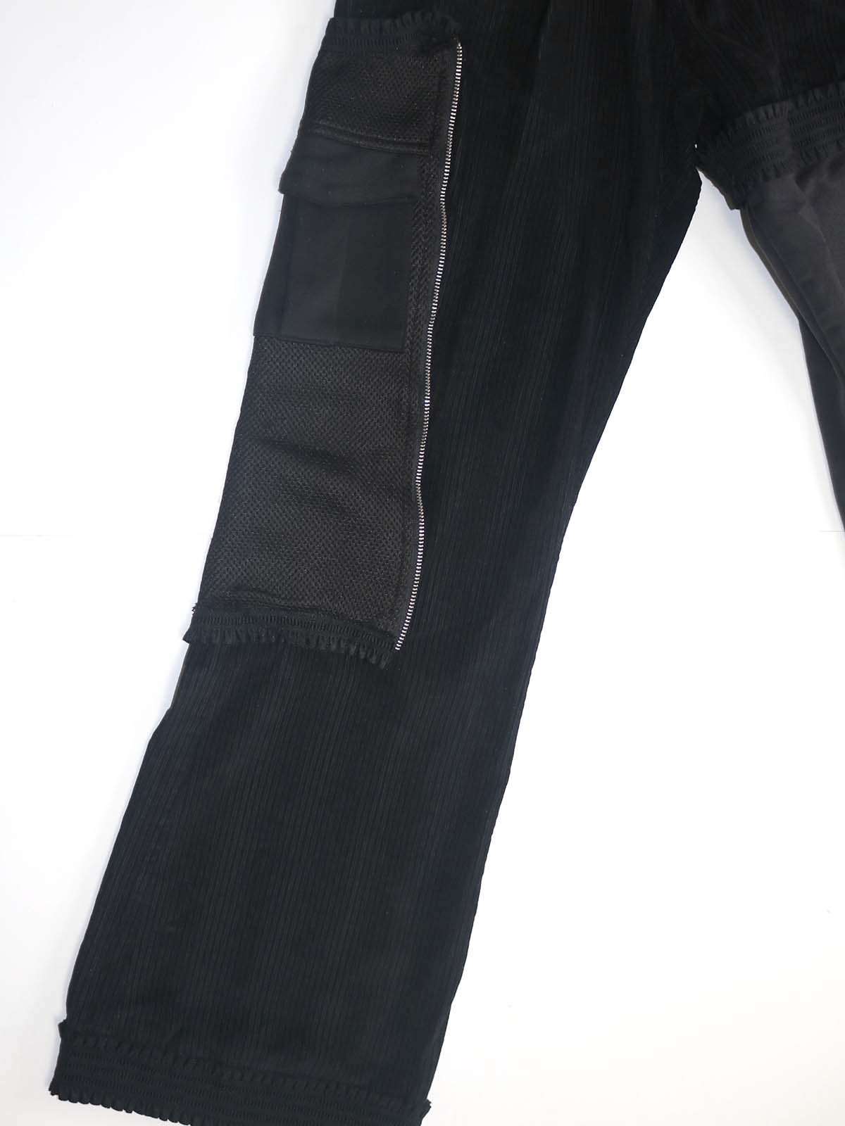 ASYMMETRICAL SLIM/WIDE STACKED RUFFLE PANTS